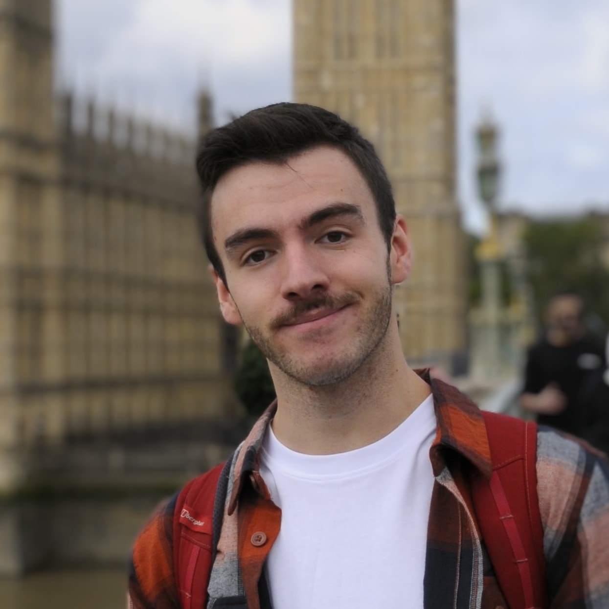 An image of a man smiling at the camera